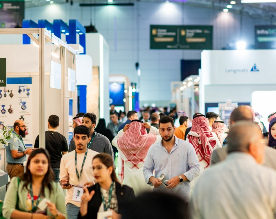 Attendees engaging with exhibitors on the exhibition floor at Global Infrastructure Expo